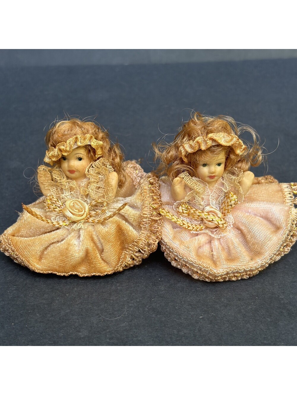 Vtg. Two Porcelain Cameo Sitting Dolls 2.5" Tall. Tea Stained
